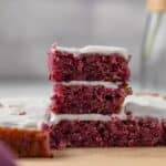 Blackberry lemon bars stacked three high.