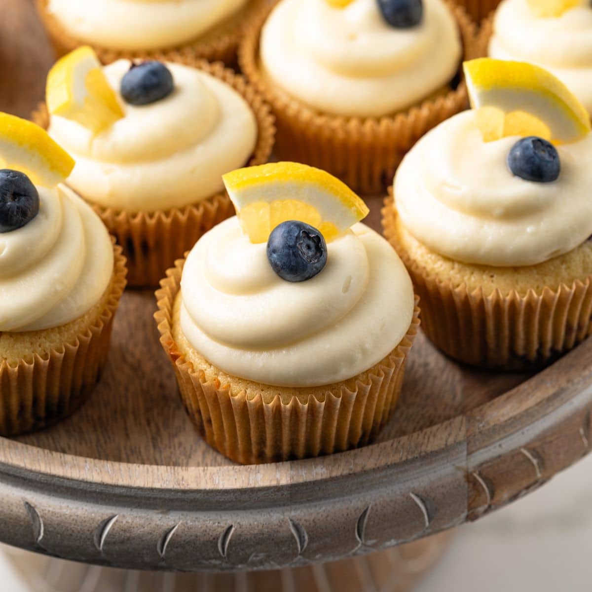 Close up of lemon blueberry cupcakes on a cake stand.