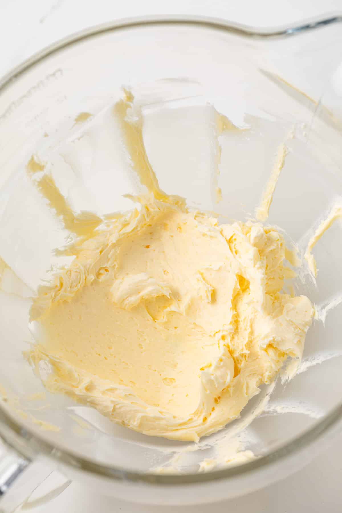 Creamed butter in glass bowl.