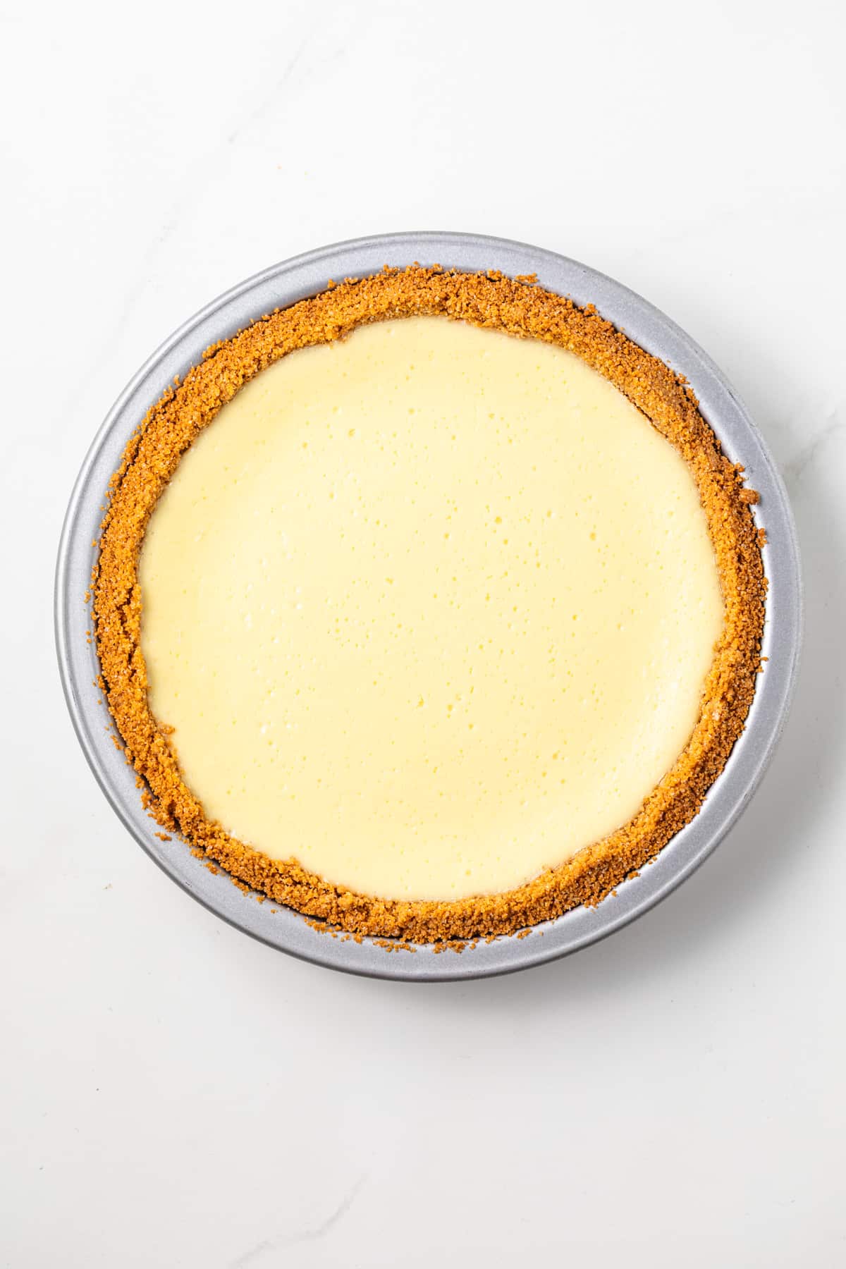 Cheesecake filling in a graham cracker crust.